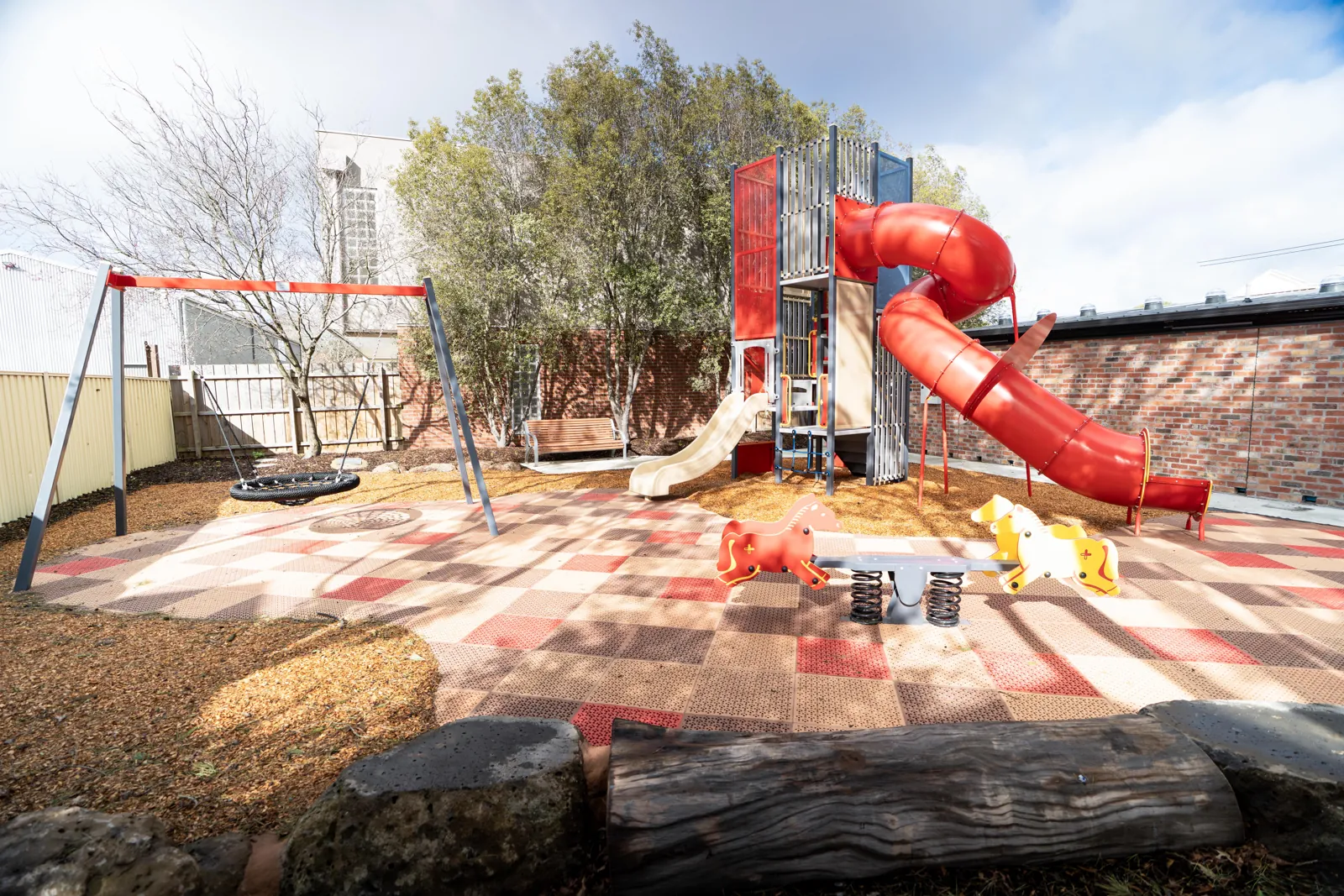 Finished playspace with soft fall surfacing and play equipment