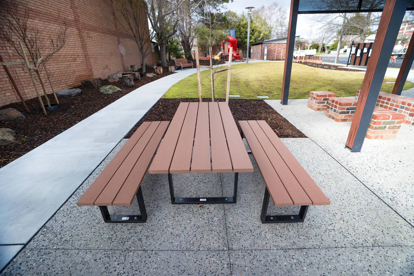Bench seating alongside a completed concrete shared path