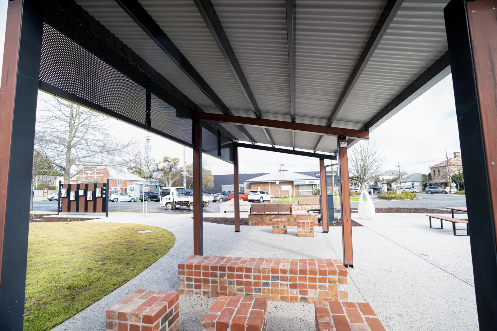Completed shelter with brick paved surround in a park