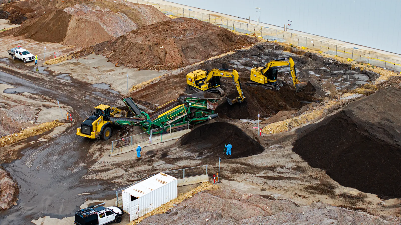 Aerial view of graded material stockpiles on a work site